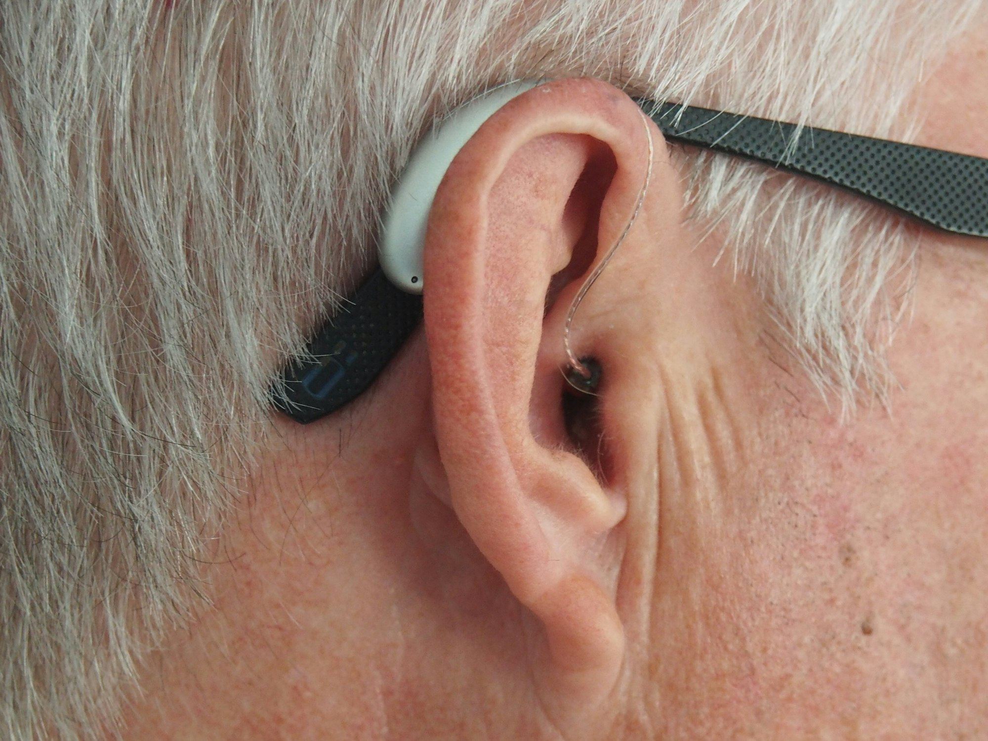 Close-up of an ear wearing a hearing aid